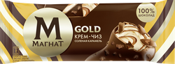Мороженое МАГНАТ Gold Крем-чиз Соленая карамель, сливочное с крем-чиз и соусом соленая карамель в молочном шоколаде с печеньем 8%, без змж, эскимо, 65г, крупный план